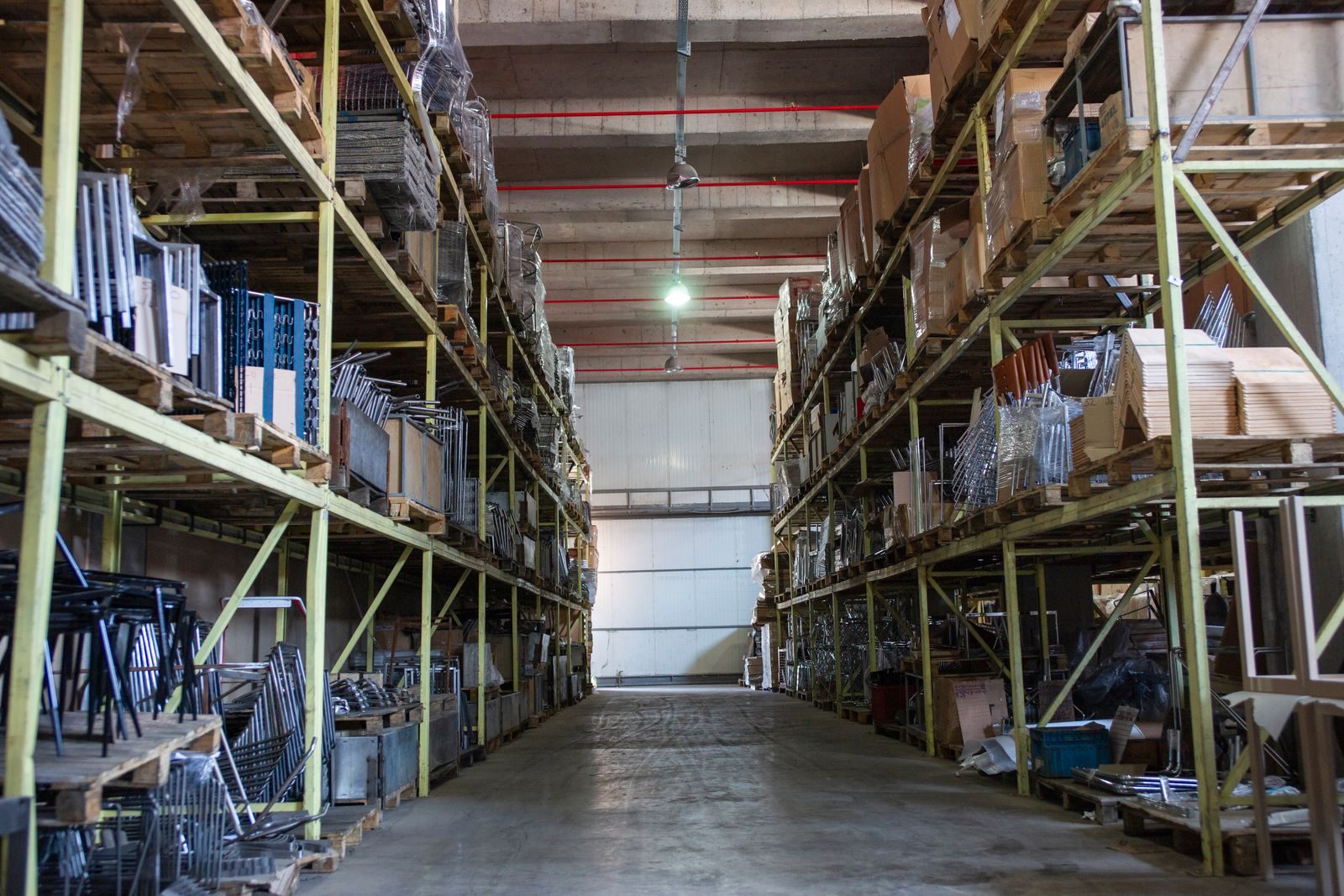 Pallets of goods stacked in a warehouse.