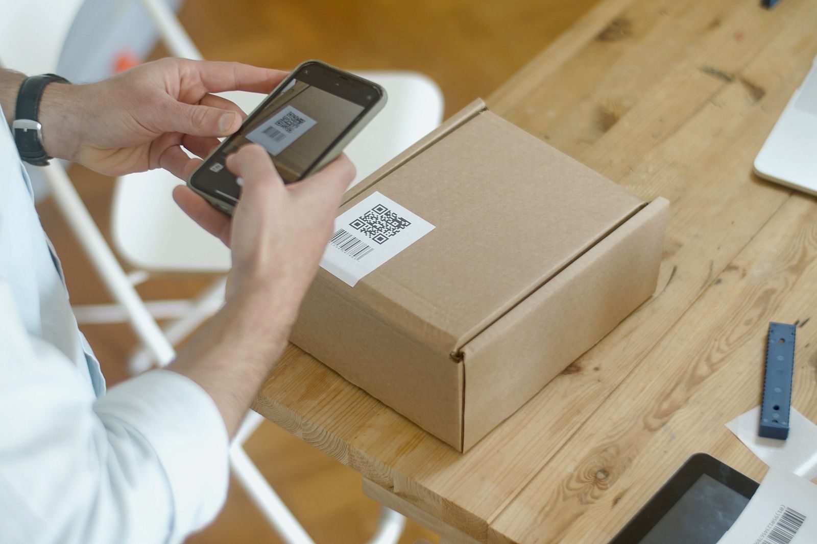 A barcode being scanned on a parcel.